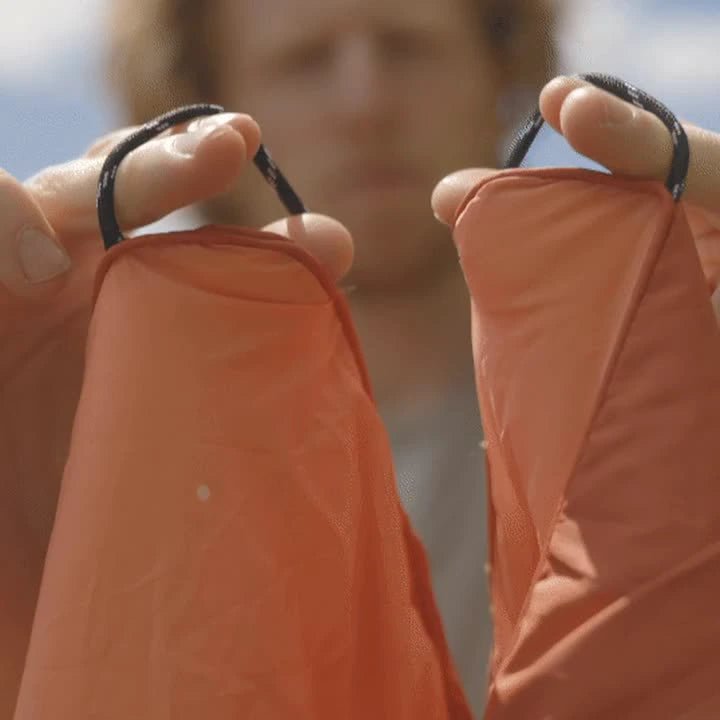 Actual braided corner loops on an orange Kukün blanket.