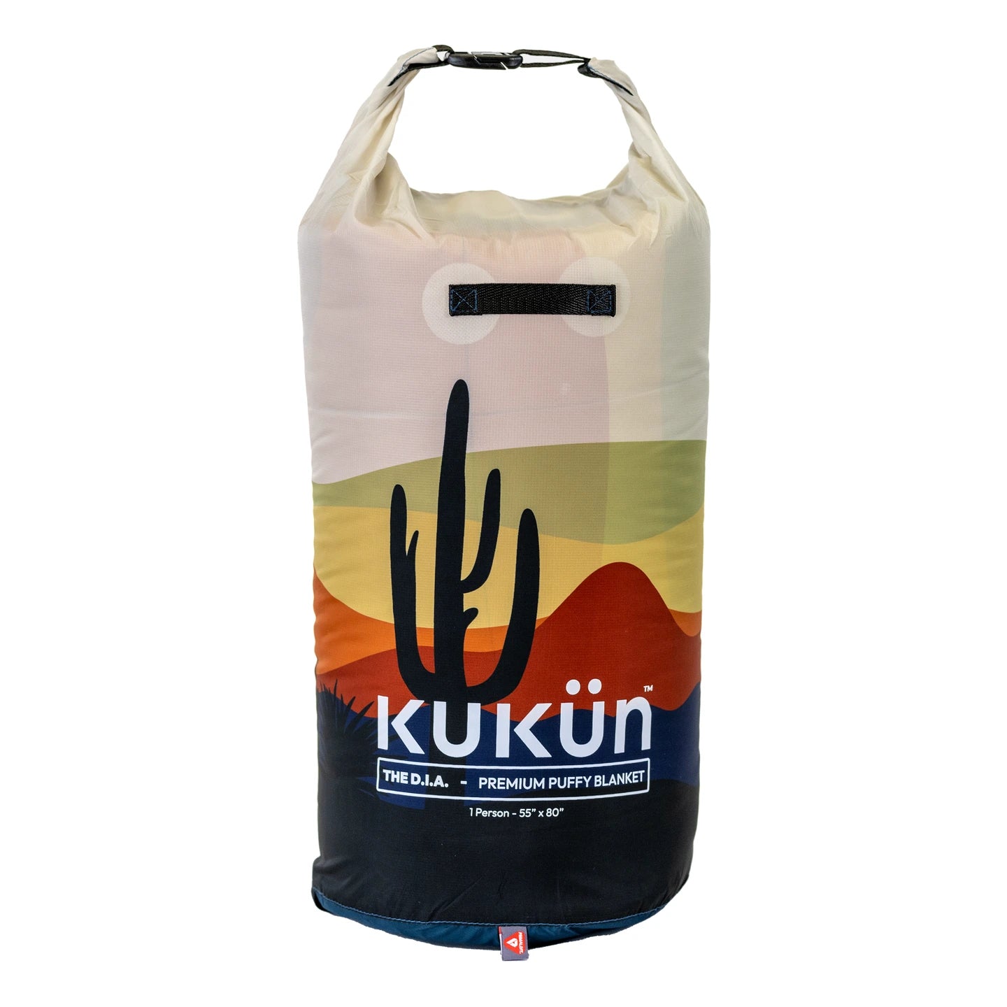 Desert blanket packed in its printed roll-top stuff sack, with the closure fastened.